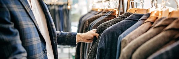 Businessman trying suit in store